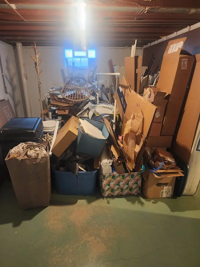 Roll-off dumpster container at job site for 2 Yard Dumpster Rental in Colonie